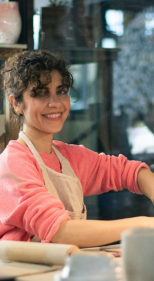 a woman sitting at a table in front of a