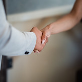 Business professionals shaking hands