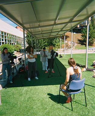 Team conducting rugby project interview and on-site content creation