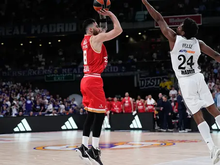 Real Madrid player contests a shot against Olympiacos during a EuroLeague game at Movistar Arena