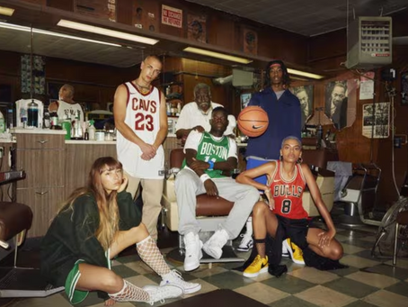 Young people wearing classic NBA jerseys inside a barbershop, representing the connection between basketball, fashion, music, and modern culture