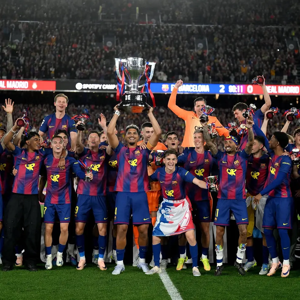 FC Barcelona players celebrate winning El Clásico with the trophy at Spotify Camp Nou after defeating Real Madrid.