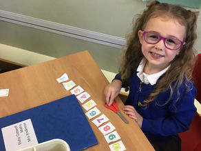 Child cutting up numbers