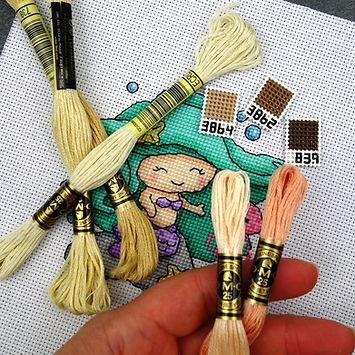 mermaid with swatches and thread skeins 2.JPG