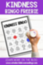 Hand holding a stamp marks a "Kindness Bingo" card. Purple header reads "KINDNESS BINGO FREEBIE." Blog link below.