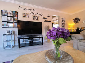 Side View. Nikk May: Private Studio For Voice | Piano | Guitar.