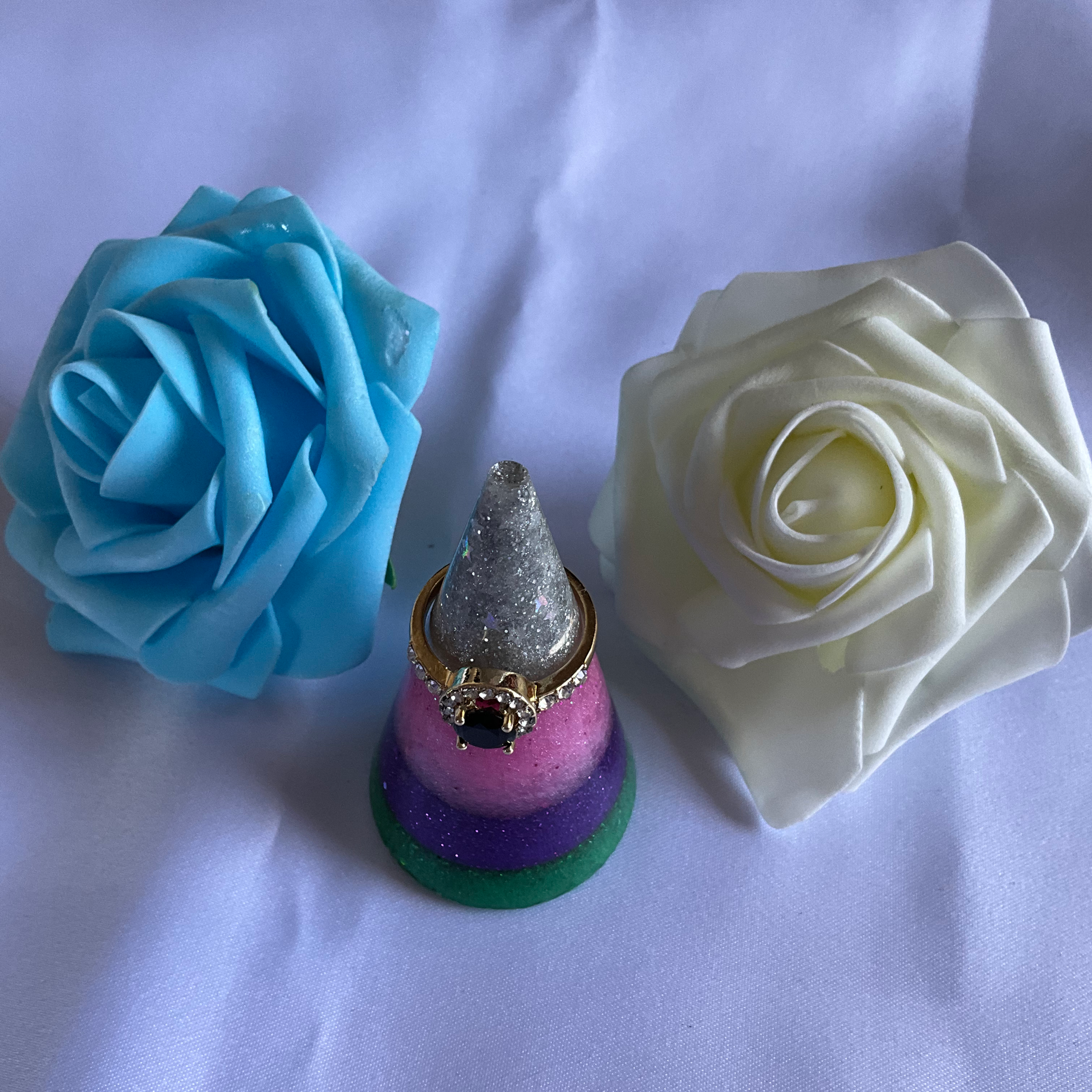 Silver, pink, purple, and green cone shaped resin ring holder