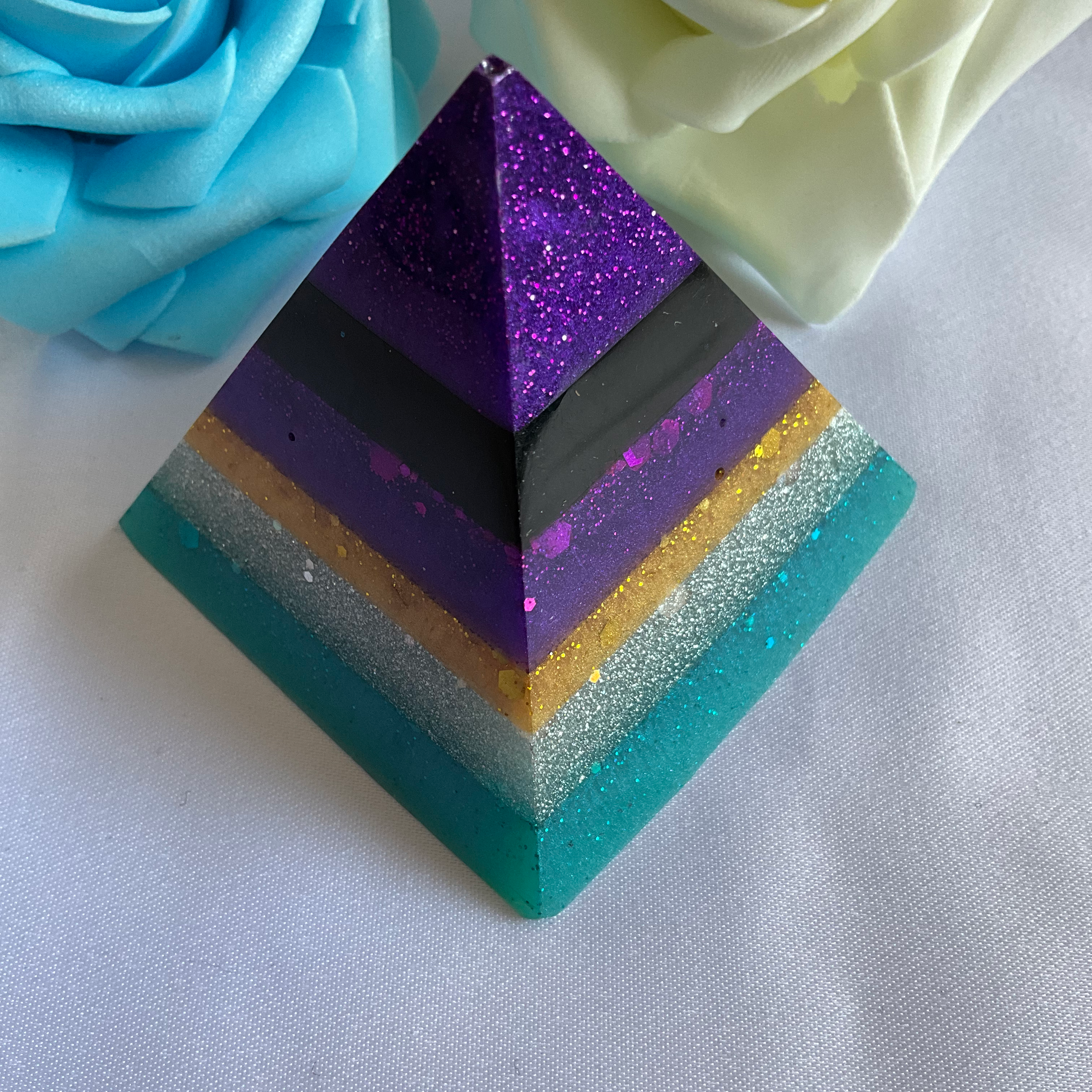 Purple, gold and teal resin pyramid