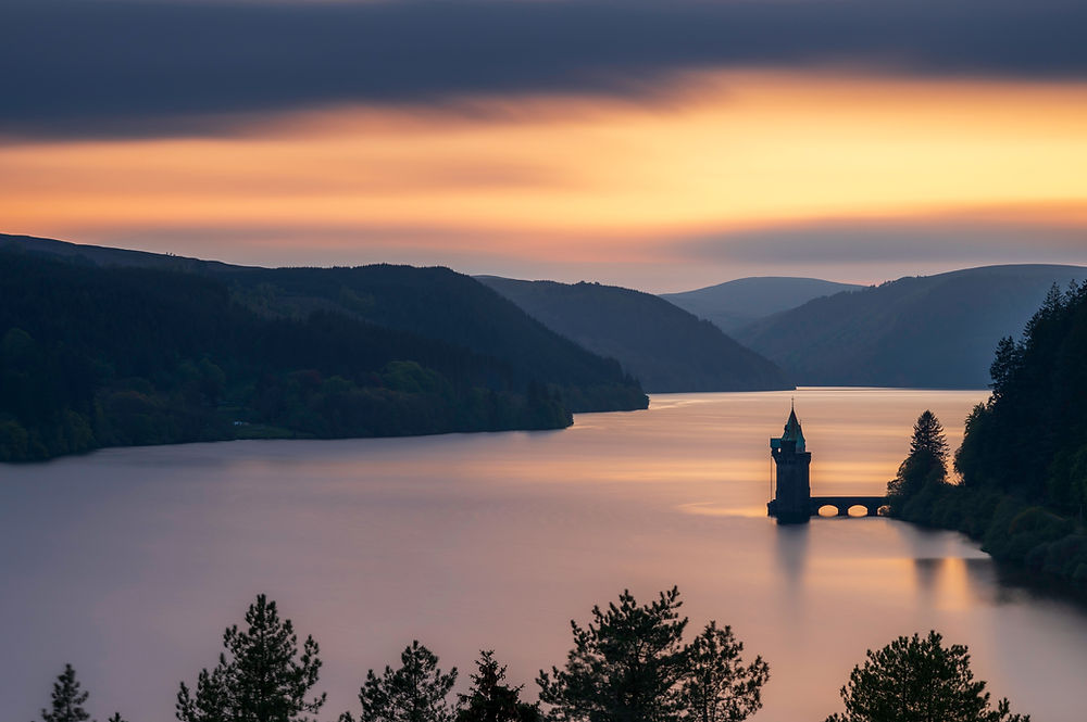 Lake Vyrnwy at sunset near a luxury glamping pod in wales