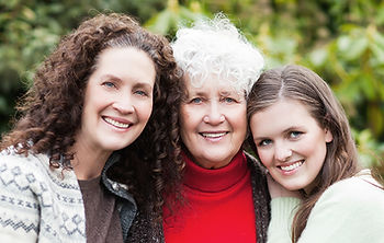 Grandmother, daughter, and granddaughter hugging, symbolizing family love, healing, and connection at FaithWorks Counseling.