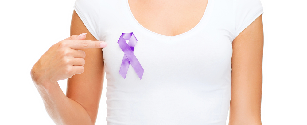 Close up of woman with purple awareness ribbon