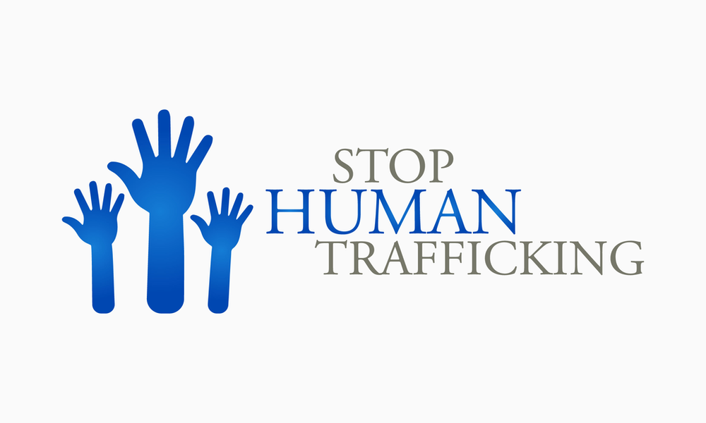 stop human trafficking with hands raised in awareness