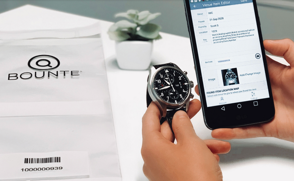 BOUNTE lost and found software program on a cell phone with a shipping package with BOUNTE logo