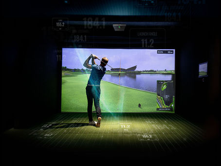 Golfer swinging indoors using TrackMan iO