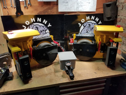 A pair of Johnny Jaws on a work bench.