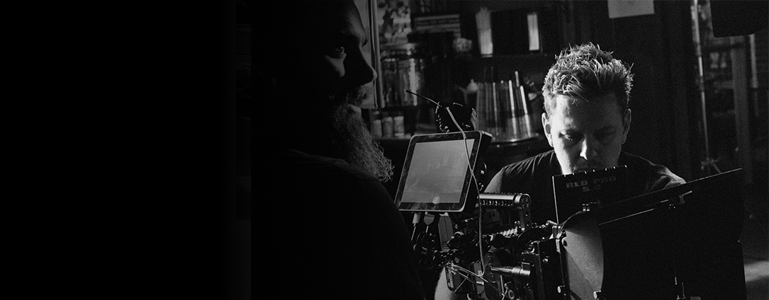 Co-founders Bradley & Ruan at a film production set. Ruan prepares camera and Bradley positions lights in a short film, "Beyond Inclusion".