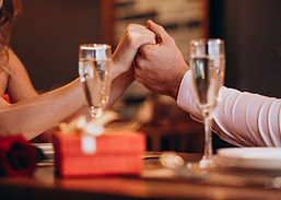 couple-holding-hands-valentines-evening-restaurant.jpg