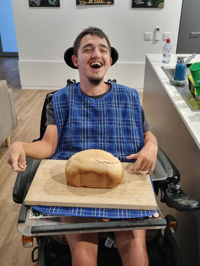 Tim in his SIL accommodation baking some bread