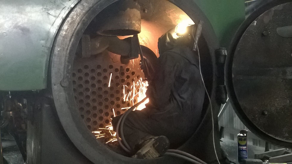 Cutting the old bolts out of the main steam pipes to the cylinders at the beginning of overhaul