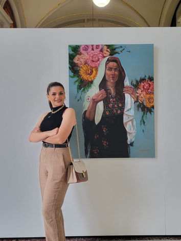 Me and my artwork, “The Palestinian Traditional Thobe” | Iowa Exhibited XXXVII