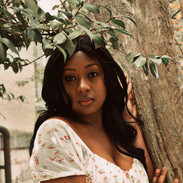 Model posed against a tree