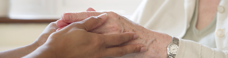 Caregiver holding hands