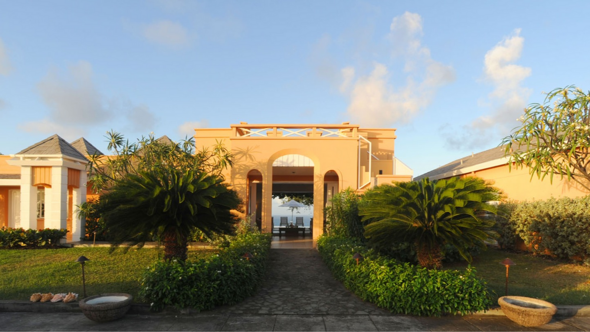 Salamander Mustique
The design of this holiday home is comprised of a series of single volume pavilions stretched along a southern ridge on the island of Mustique.
Double aspect rooms take full advantage of the site and provide spectacular views of both the Atlantic and the Caribbean Sea with generous openings framing both sunrise and the sunset panoramas.
In quiet contrast to the site’s wildness, the scale and detailing of the architectural language borrows from the local context paying homage to Oliver Messel, the author of Mustique's vernacular.