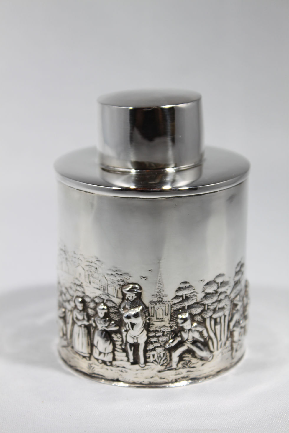 Thumbnail: Silver tea caddy with repoussé rural scene