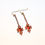 Thumbnail: Pair of gold and garnet earrings