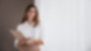 front-view-elegant-businesswoman-holding-clipboard-with-copy-space_edited.jpg