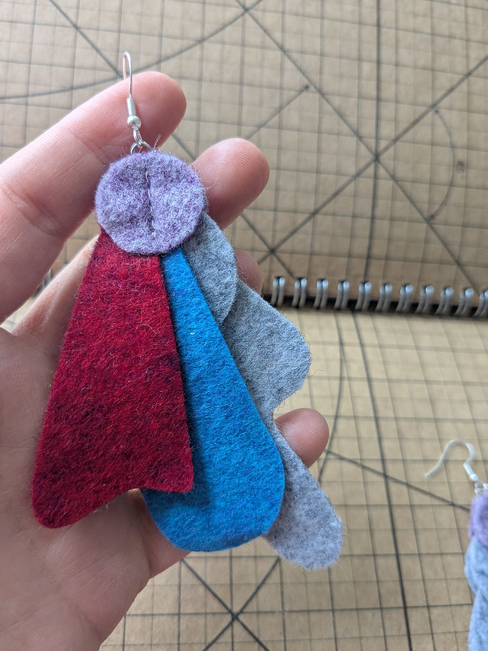Thumbnail: Heahered felt earrings in purple, red, blue and grey