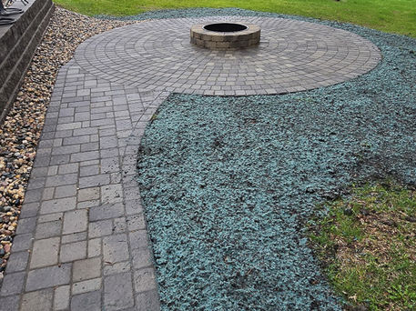 Circular firepit and paver patio by Collins Landscaping in Perham MN