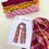 Thumbnail: pink, orange and yellow skeins of yarn and a pattern to weave the scarf shown