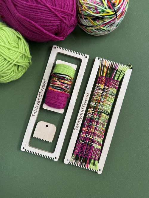 pink and green woven bookmark loom on a green background