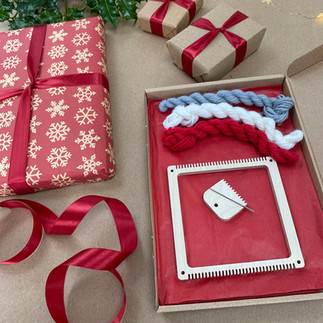 square frame loom weaving kit in christmas colours being gift wrapped