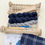 Thumbnail: wooden rigid heddle weaving loom with navy and grey skeins of yarn and accessories