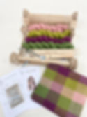 rigid heddle weaving loom kit with pink and green yarn