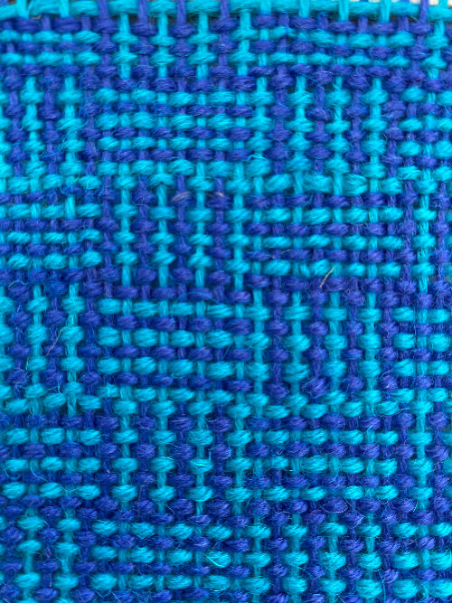 log cabin weave on a tabbyandtweed square frame loom using blue and turquoise yarn colours