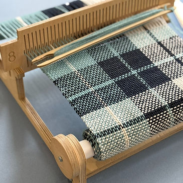 rigid-heddle-weaving-loom-with-blue-checked-pattern