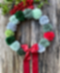red and green festive christmas pom pom wreath