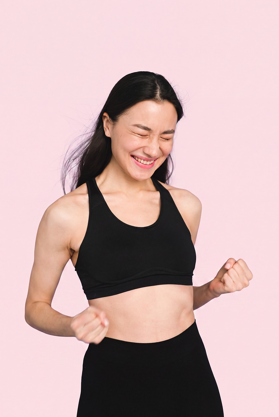 Woman smiling confidently, representing relief from gut discomfort with Capsation