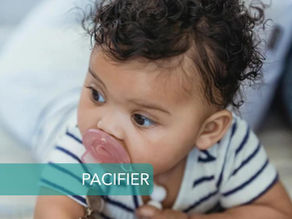 baby crawling with pacifier