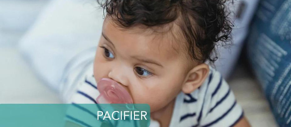 baby crawling with pacifier