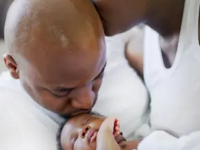mom kisses dad, dad kisses child