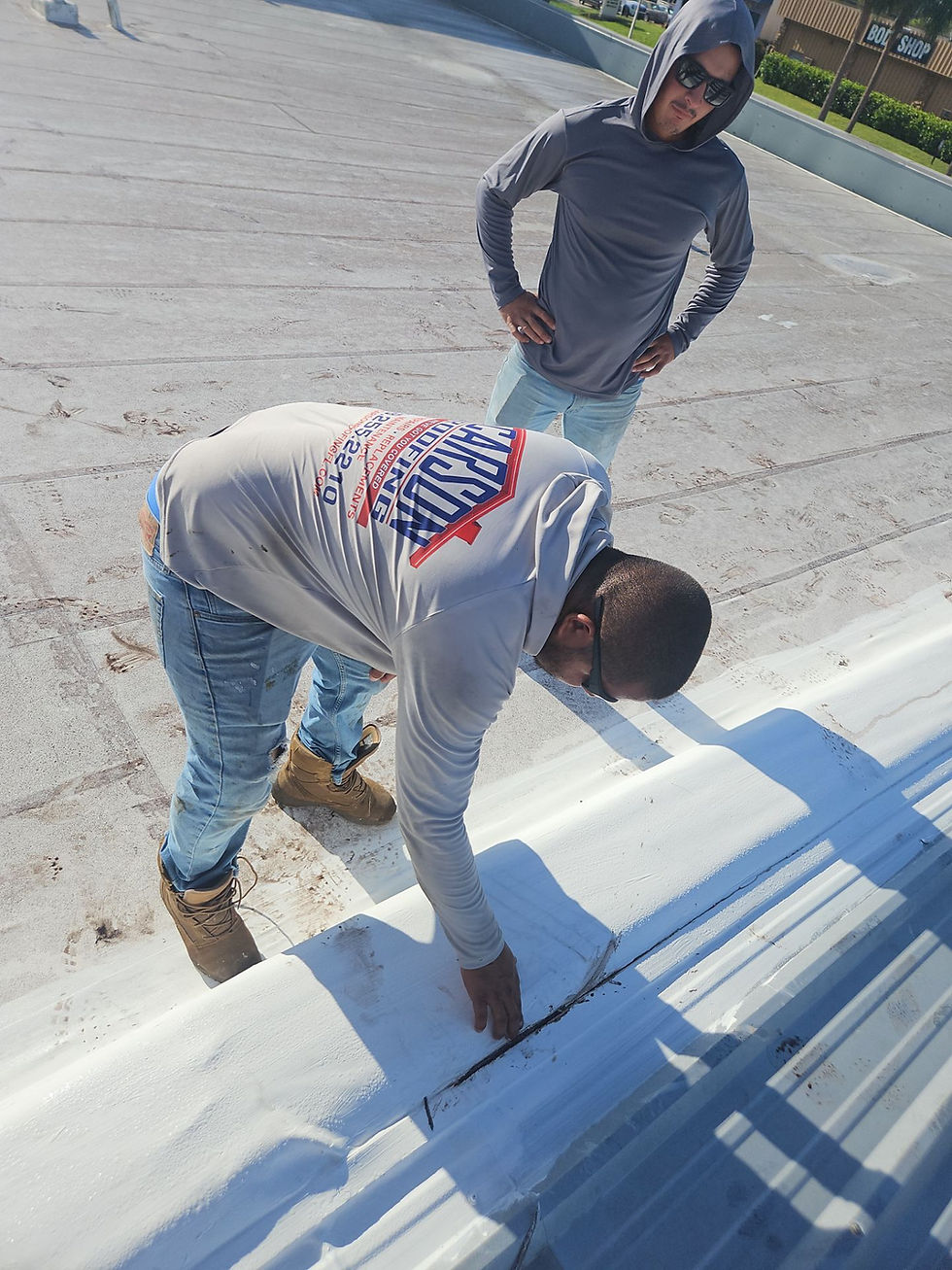 Eye-level view of a roofing professional inspecting shingles on a residential roof