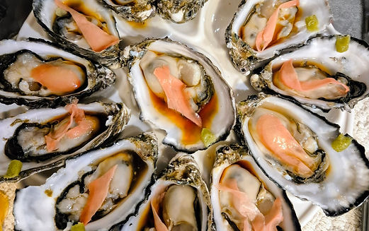 A plate of Coffin Bay Oysters with ginger, wasabi and soy