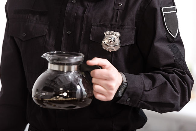 cropped-view-of-police-officer-holding-glass-pot-o-2024-11-09-02-22-57-utc.jpg