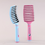 Thumbnail: Pink and blue detangling hair brushes