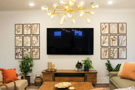 Gallery wall and chandelier