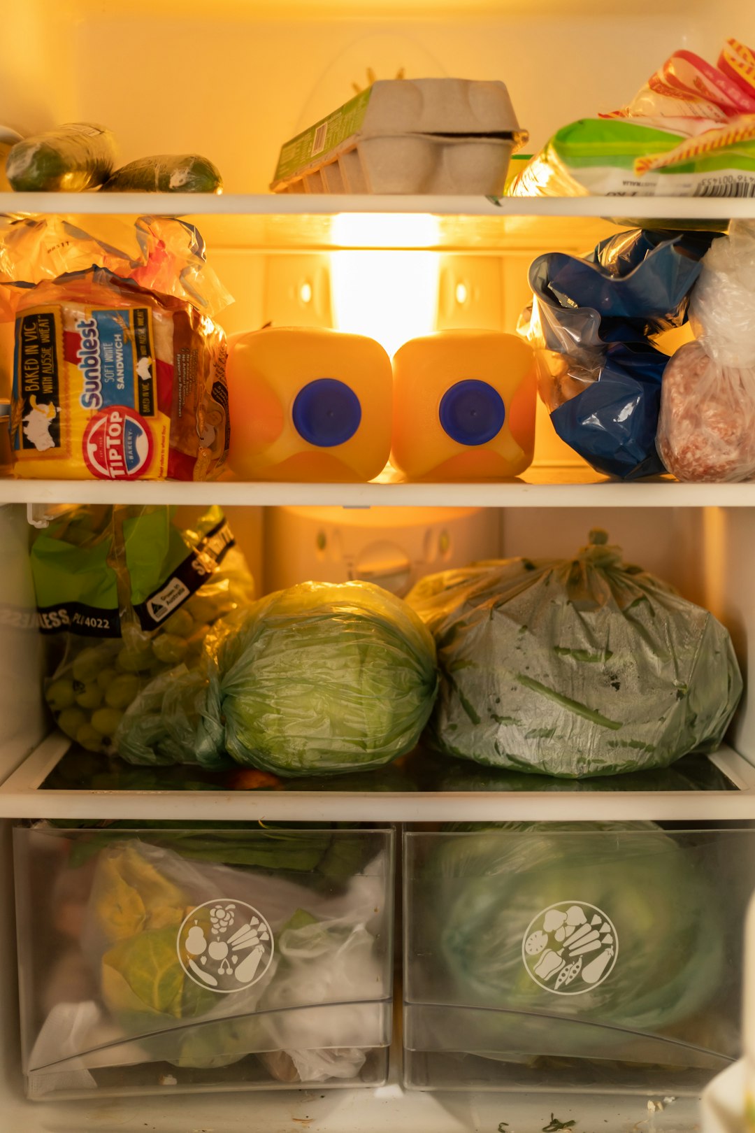 Organized meal prep containers in fridge